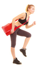 Fototapeta na wymiar Sport. Fitness sporty girl with gym bag running to training