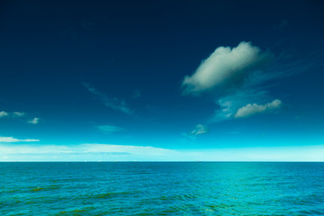 Naklejka na ściany i meble Landscape. View of blue sky at sea or ocean water.
