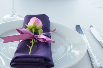 Festive table setting in the restaurant with flowers. Wedding decor.