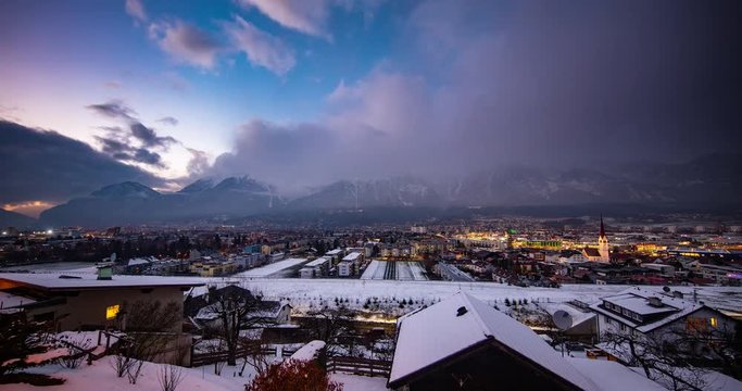 Innsbruck, Austria - view from Bichlweg / Ambraser Castle-Park via Innsbruck on snowy Alps at sunset - Timelapse without motion
