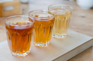 glass of tea on wooden table