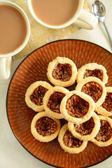 Pecan tarts and coffee