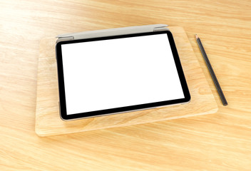 Blank screen tablet on wood plate at wooden table top,Mock up te