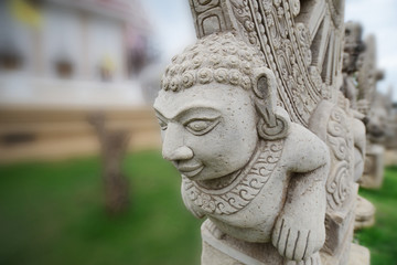 Fototapeta na wymiar Stone statue imitating art of Asian ancient.