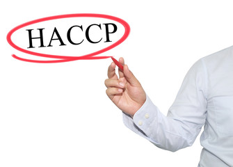 Hand of man write text HACCP with black color isolated on white