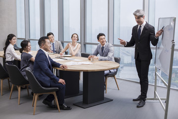 Business people having meeting in board room