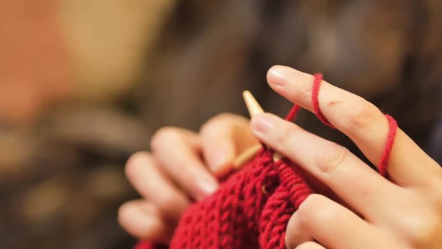 woman hands doing knitting Close-up shot