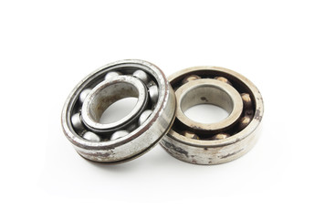 Two old rusty bearing on a white background