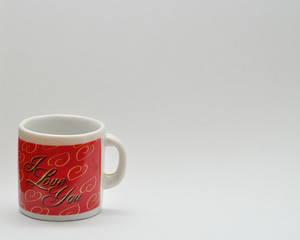 Valentine's Day. A small red mug with the lettering I love you
