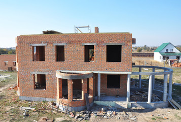 Built residential brick house. House Construction Site.