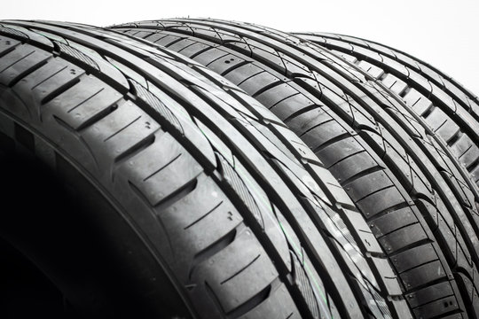 Car tires background in a row on white background. rubber