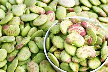 A bowl of raw red green beans