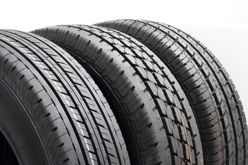 Car tires background in a row on white background. rubber