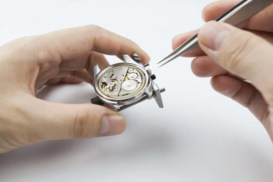 Chinese watchmaker repairing a wristwatch