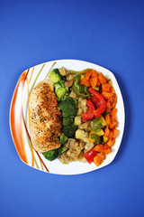 chicken breast with vegetables on a blue background 3