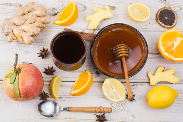 Natural flu and cold remedy - orange and lemon fruit, fresh ginger, honey