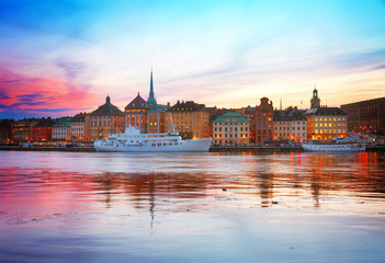 Fototapeta premium colorful sunset scenery of the Old Town in Stockholm, Sweden, toned