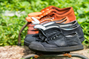 black and brown canvas shoes drying