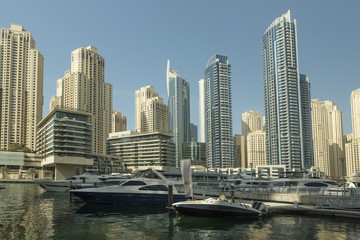Fototapeta na wymiar Luxury yacht and scyscrapers in center of Dubai, Unidet Arab Emirates.