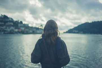 Woman by river in small town