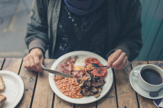 Woman having english breakfast