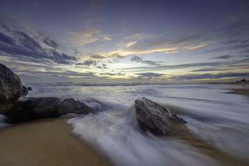 beach with rock evening light