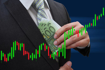 Businessman putting euro banknotes in suit pocket under Candlest