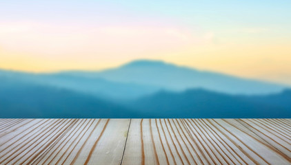 Naklejka na ściany i meble wooden balcony on landscape sunset background.