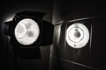 Spotlights studio to shine out of darkness.