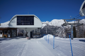 Fototapeta na wymiar ski resort panorama with cable car lift cabin. Snow mountain
