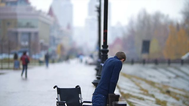 The disabled man fall on the ground. Slow motion