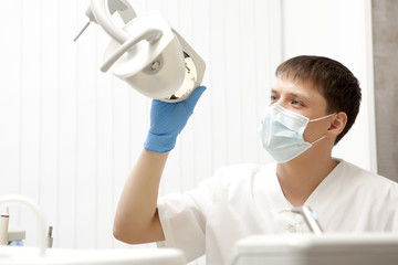 Fototapeta na wymiar Stomatology concept - happy male dentist at dental clinic office