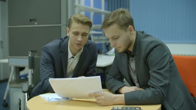 The businessman discuss agreement in the office. Real time capture