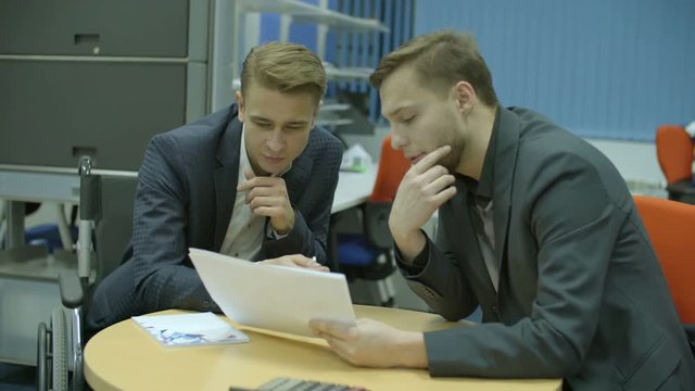 The businessman discuss agreement in the office. Real time capture
