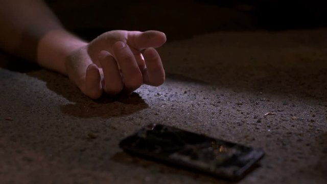 The night accident with hand and broken phone. Real time capture
