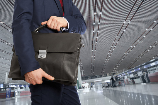  Businessman with a briefcase in airport
