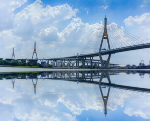 Bhumibol  bridge 1 and 2 so called Industrial Ring Bridge crossing The Chao Phraya River with reflection , Bangkok, Thailand