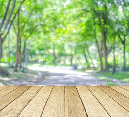 Perspective wood over blur trees with bokeh background