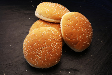 The burger buns on black background