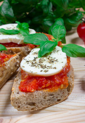 Italian bruschetta with cherry tomatoes, mozzarella & fresh basil.