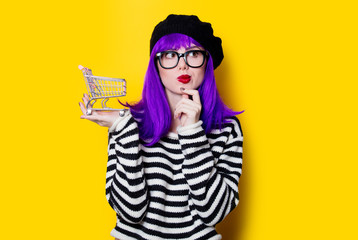 woman with purple hair and shopping cart