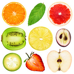 Collection of fresh fruit slices on white background. Tangerines, mint, grapefruit, kiwi, lemon, grape, pineapple guava, strawberry, apple.