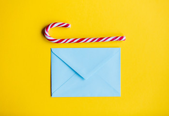 Blue christmas envelope and lolipop