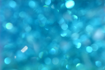 Blue Bokeh Background. Festive abstract background with bokeh lights. Blue Christmas Light. New...