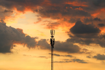 Communications tower with a beautiful sunset sky