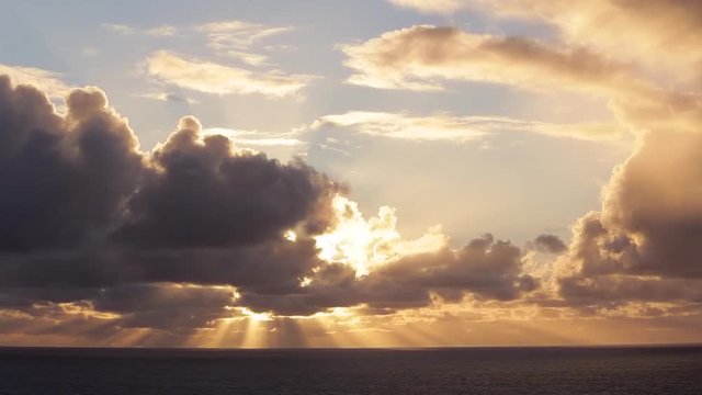 WS Sun breaking through clouds over ocean