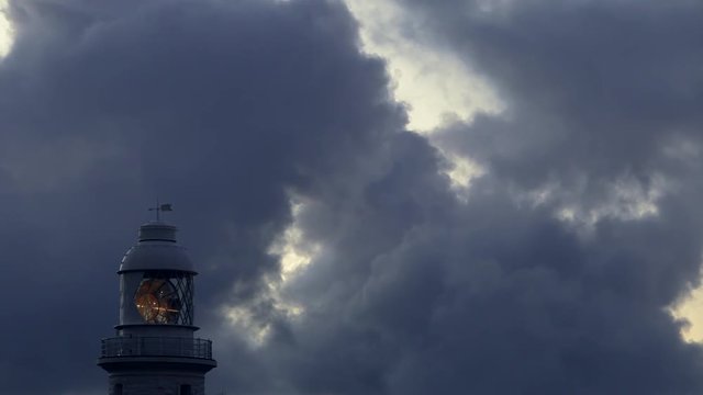 CU Light circling in lighthouse against dark sky