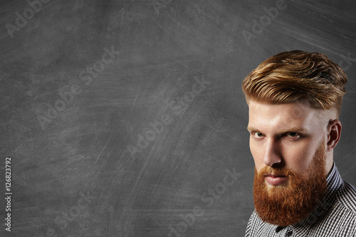 Headshot Of Courageous Brutal Young Hipster Model With