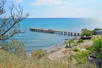 The beach and pier in the village Resort