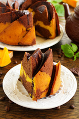 Pumpkin chocolate cake with frosting.